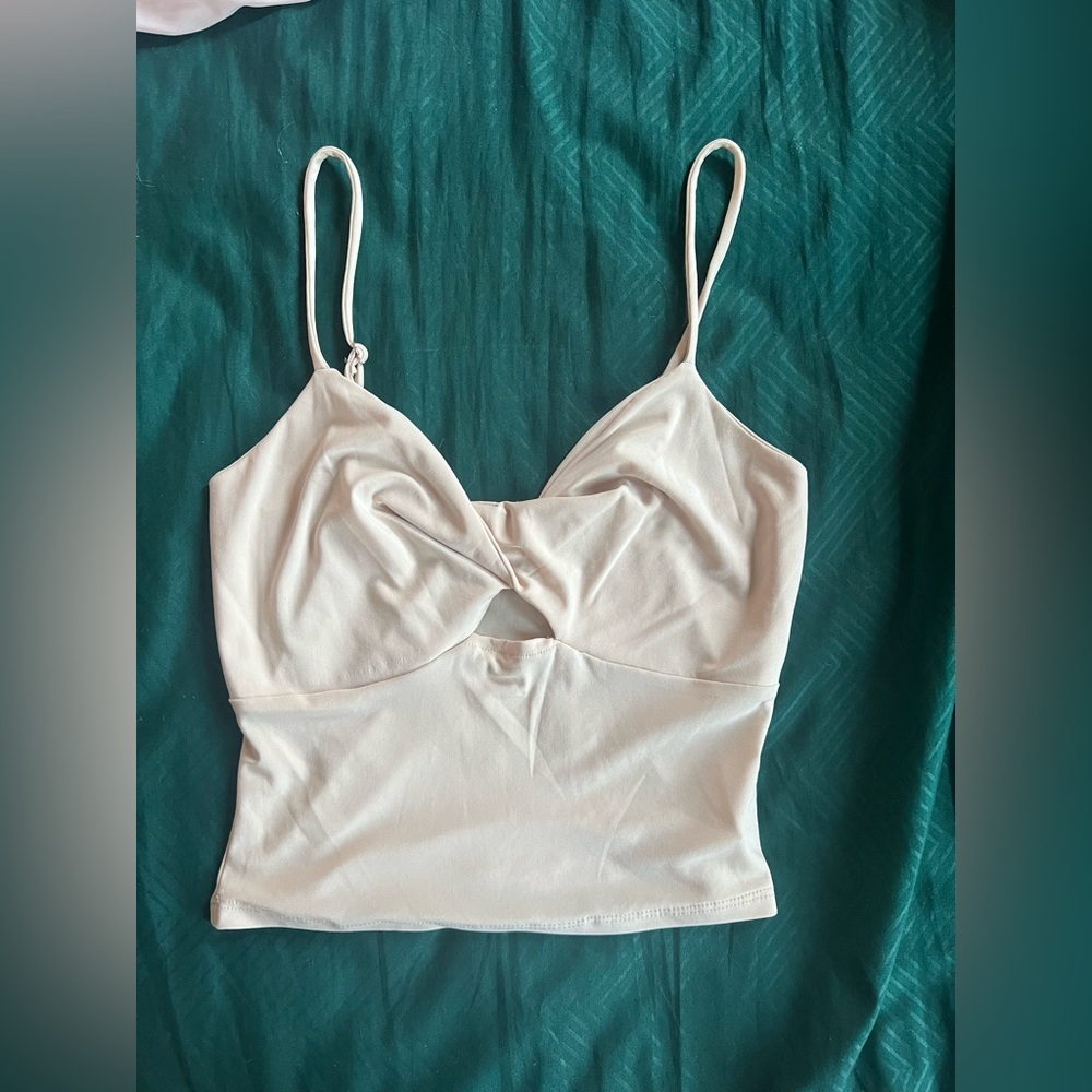 Twist-front cream top